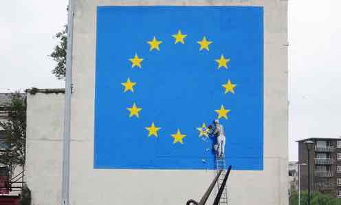 Banksy Brexit mural of man chipping away at EU flag appears in Dover